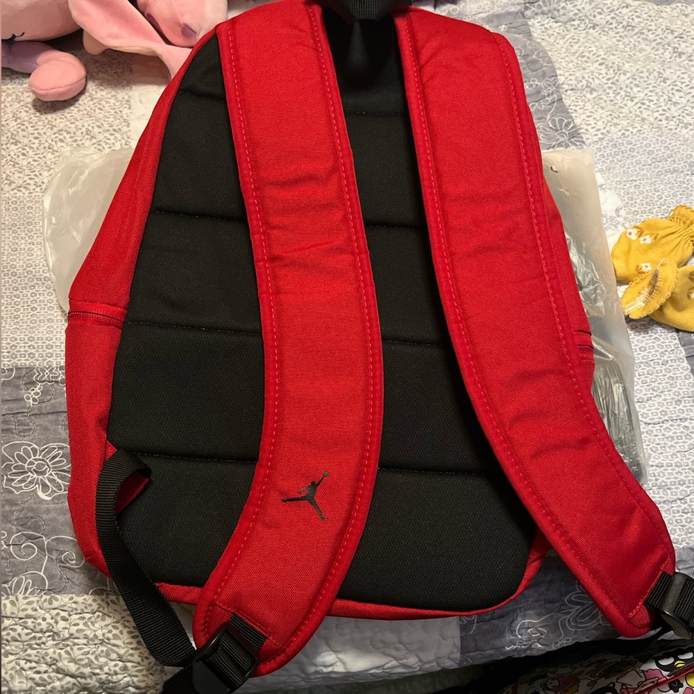 New red Jordan back pack,new never used no damage,tags still attached